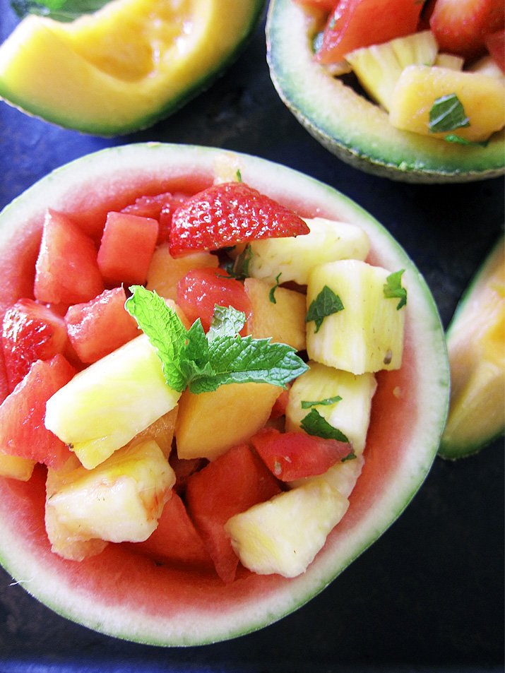 A perfect showcase for summer fruit. Juicy cantaloupe, watermelon, pineapple and berries and combined with a sweet/tart honey lime dressing.